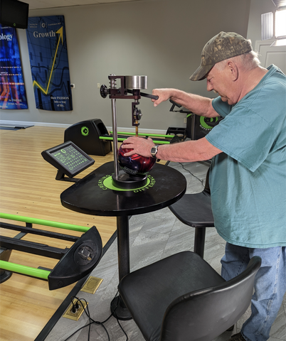 Durometer being used on a bowling ball